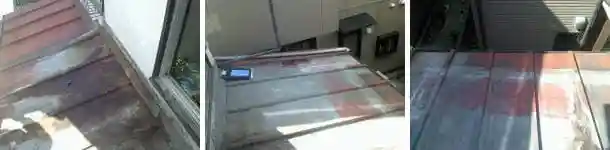 腐ってボロボロになったバルコニー下のトタン屋根